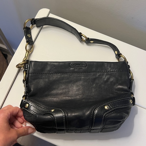 A small leather coach bag. - Picture 2 of 5